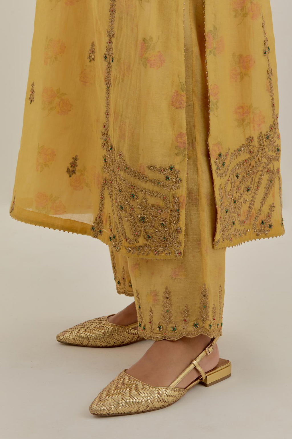 Yellow tissue chanderi straight kurta set with button placket neckline, highlighted with all-over light gold dori embroidery.