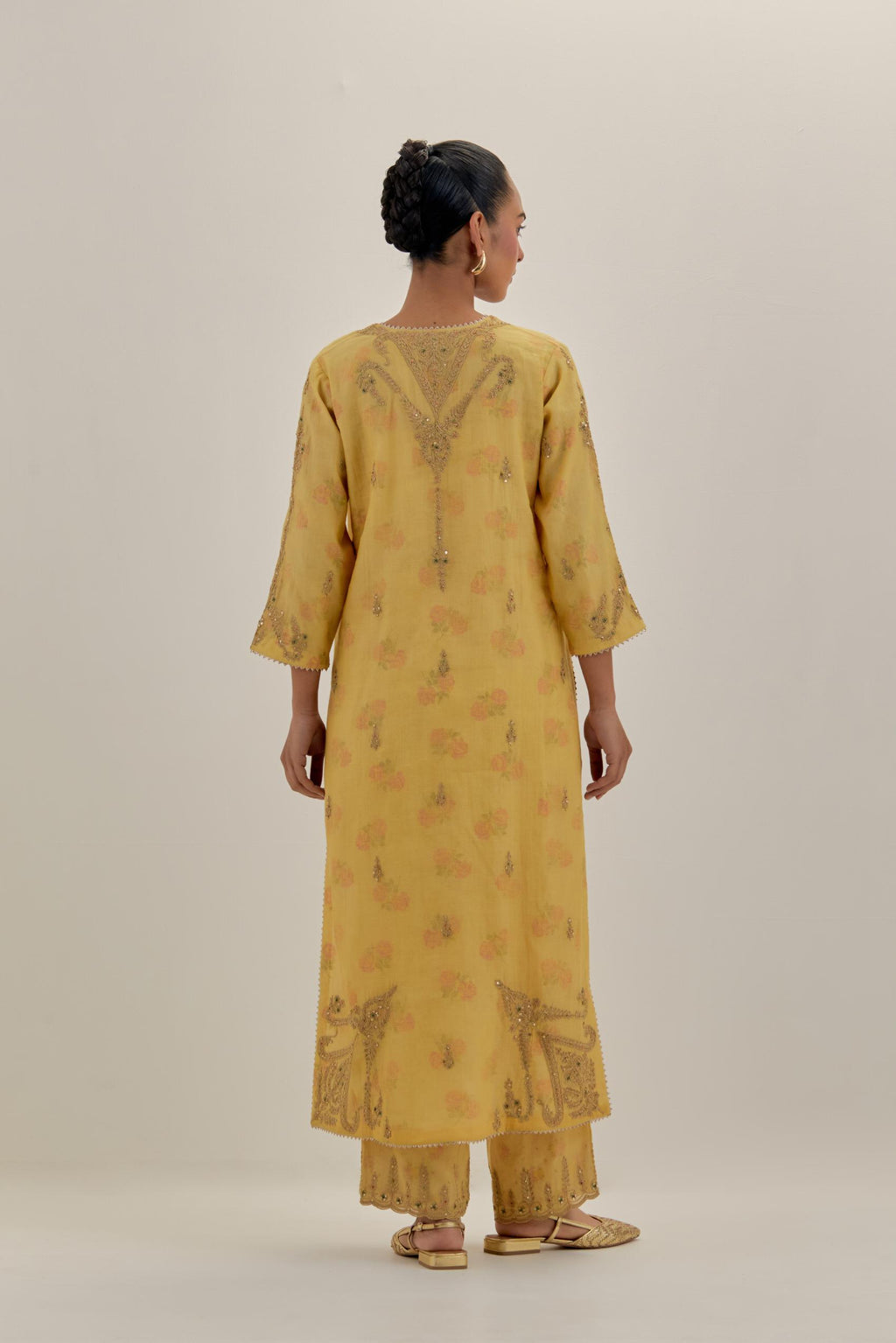 Yellow tissue chanderi straight kurta set, highlighted with light gold dori embroidery and hand block printed lining inside.