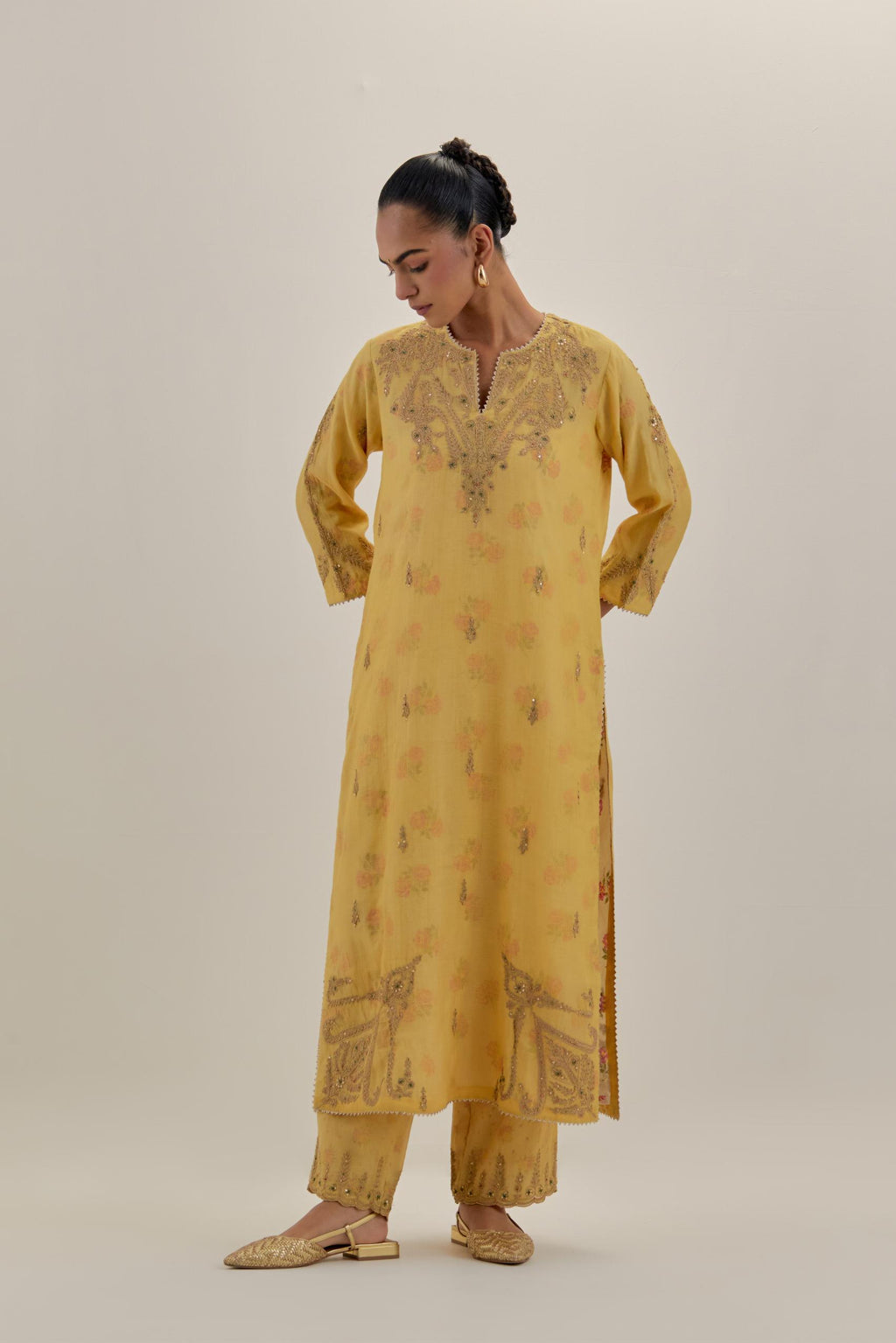 Yellow tissue chanderi straight kurta set, highlighted with light gold dori embroidery and hand block printed lining inside.