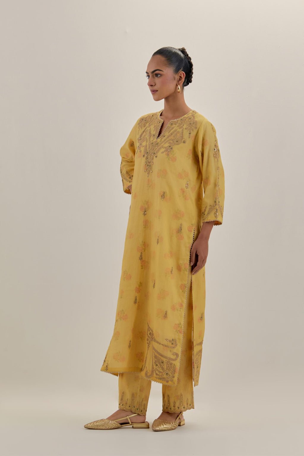 Yellow tissue chanderi straight kurta set, highlighted with light gold dori embroidery and hand block printed lining inside.