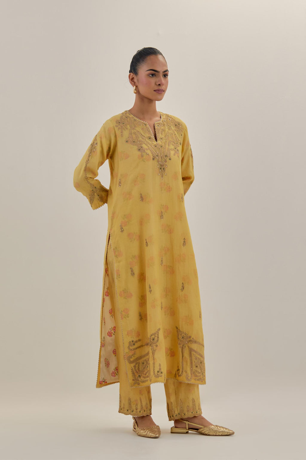 Yellow tissue chanderi straight kurta set, highlighted with light gold dori embroidery and hand block printed lining inside.