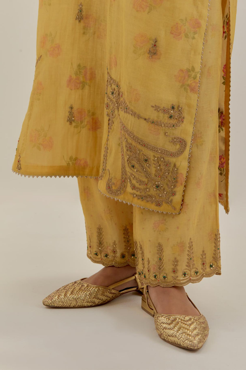 Yellow tissue chanderi straight kurta set, highlighted with light gold dori embroidery and hand block printed lining inside.