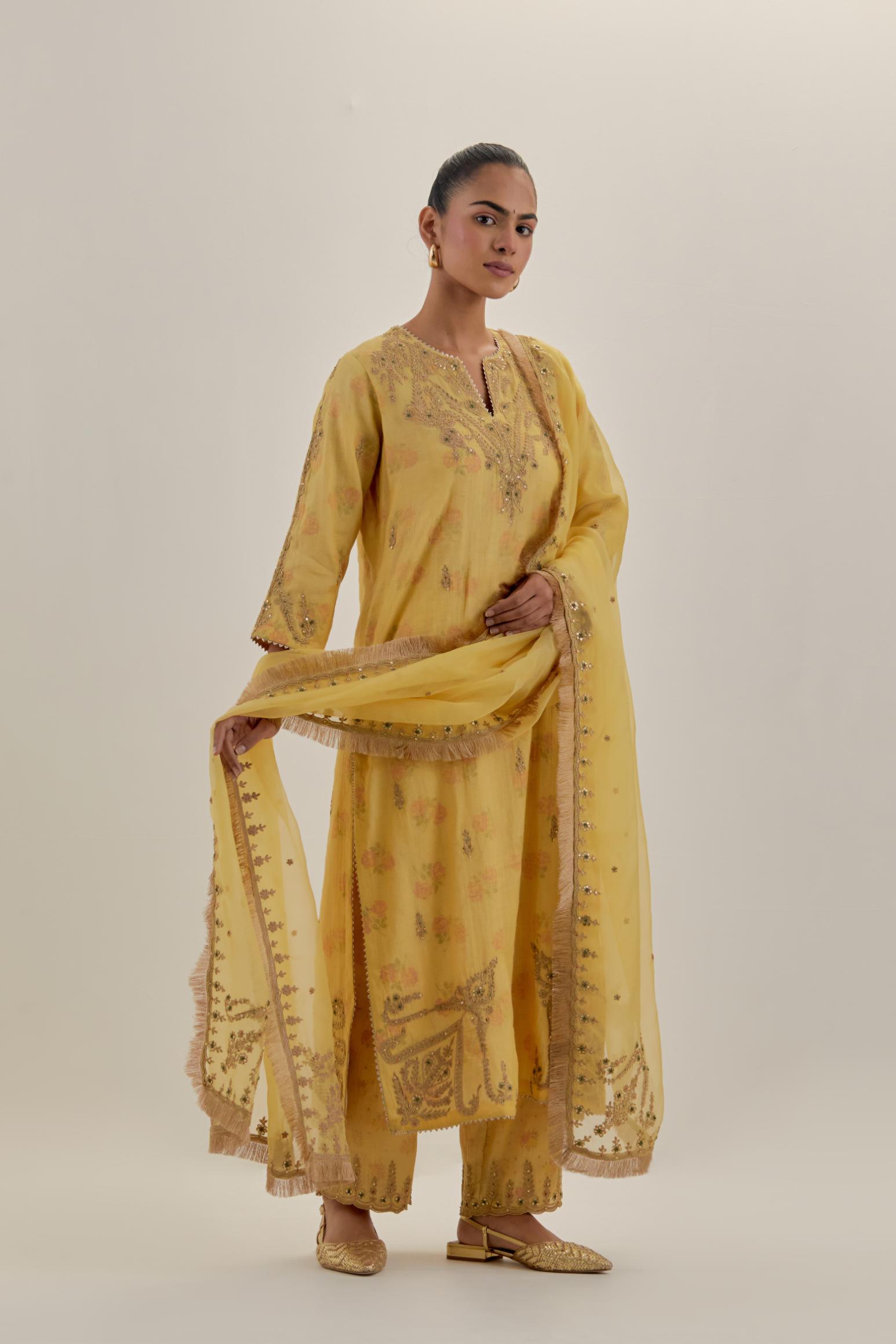Yellow tissue chanderi straight kurta set, highlighted with light gold dori embroidery and hand block printed lining inside.