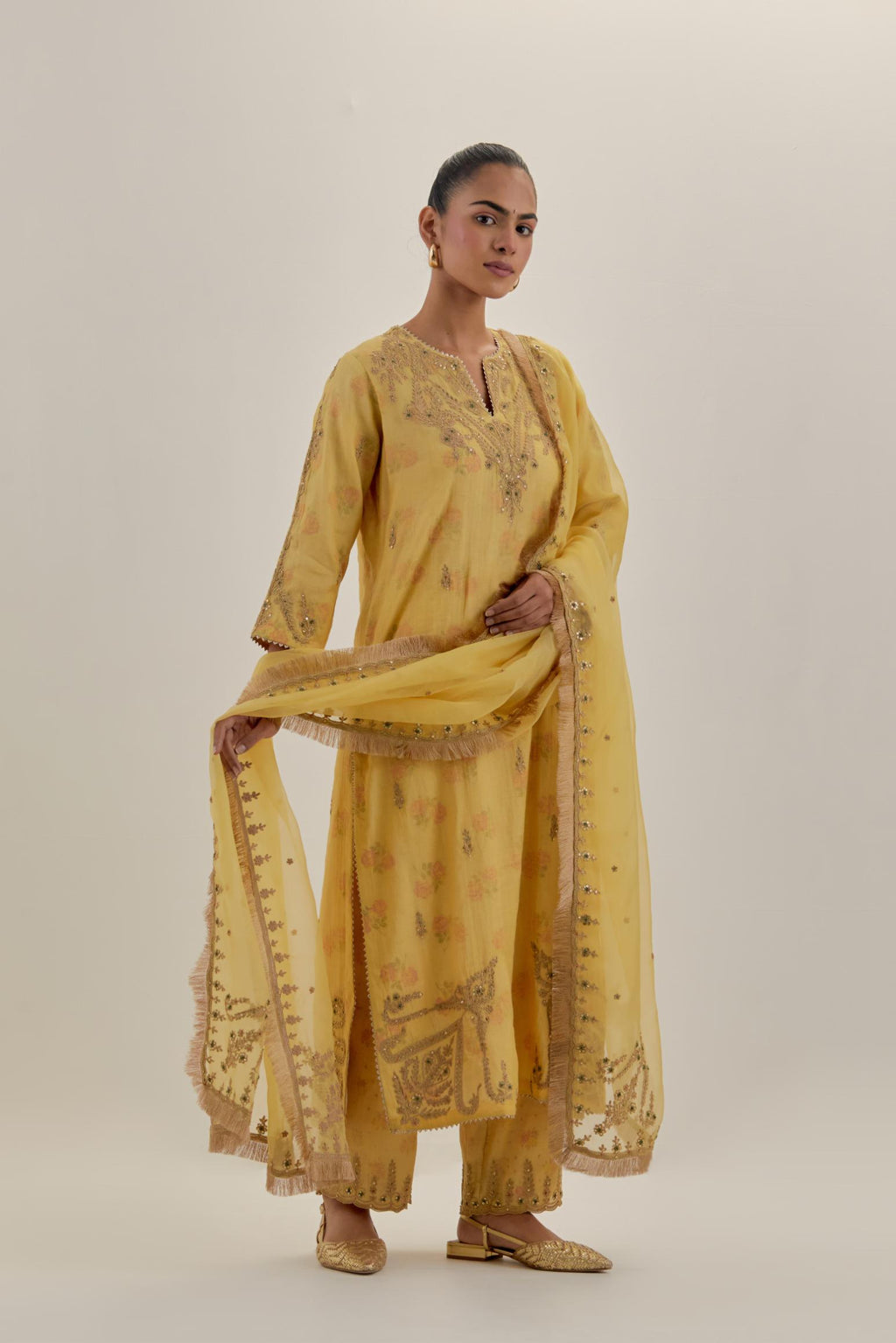 Yellow tissue chanderi straight kurta set, highlighted with light gold dori embroidery and hand block printed lining inside.