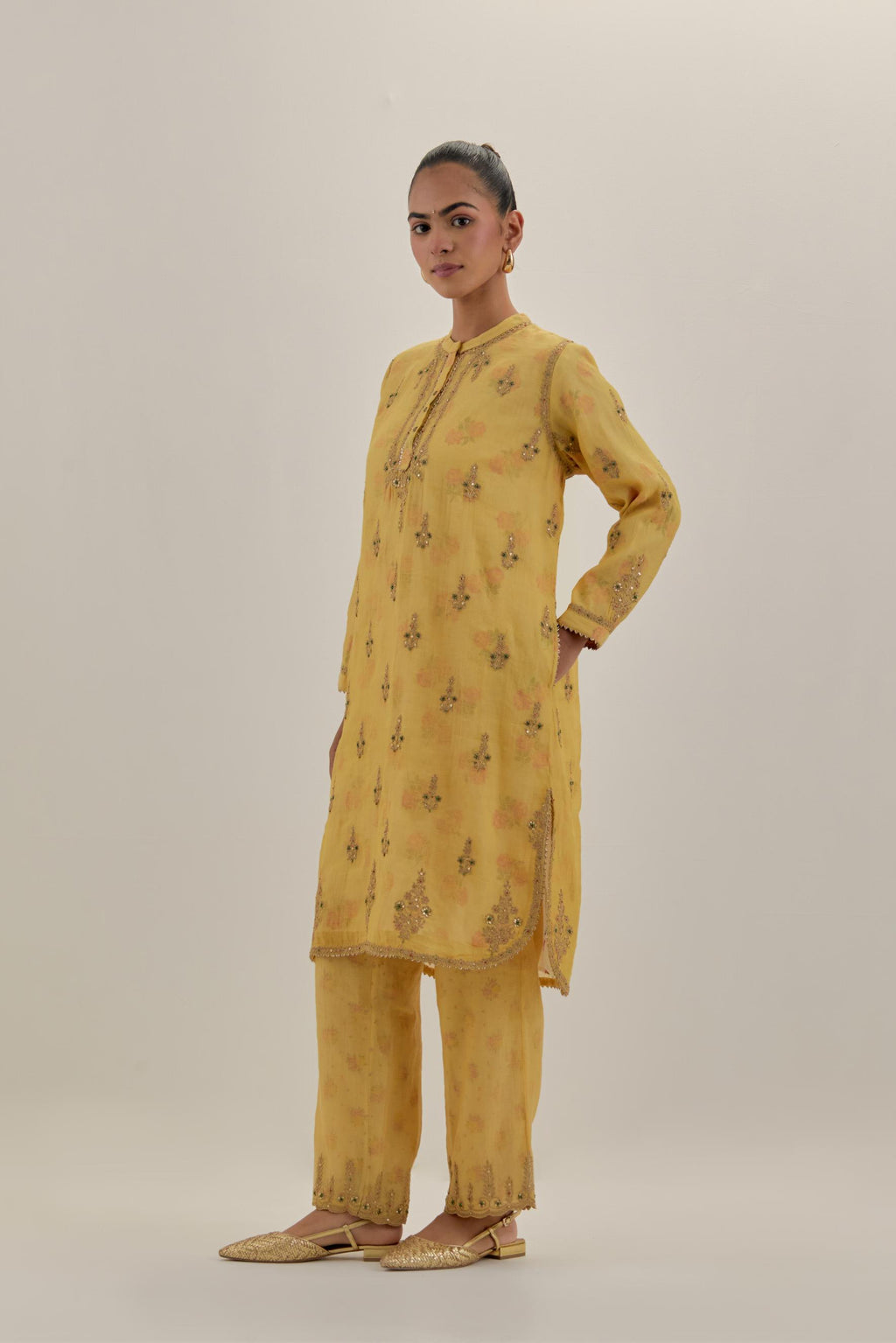 Yellow tissue chanderi straight short kurta set with all-over light gold dori embroidery.