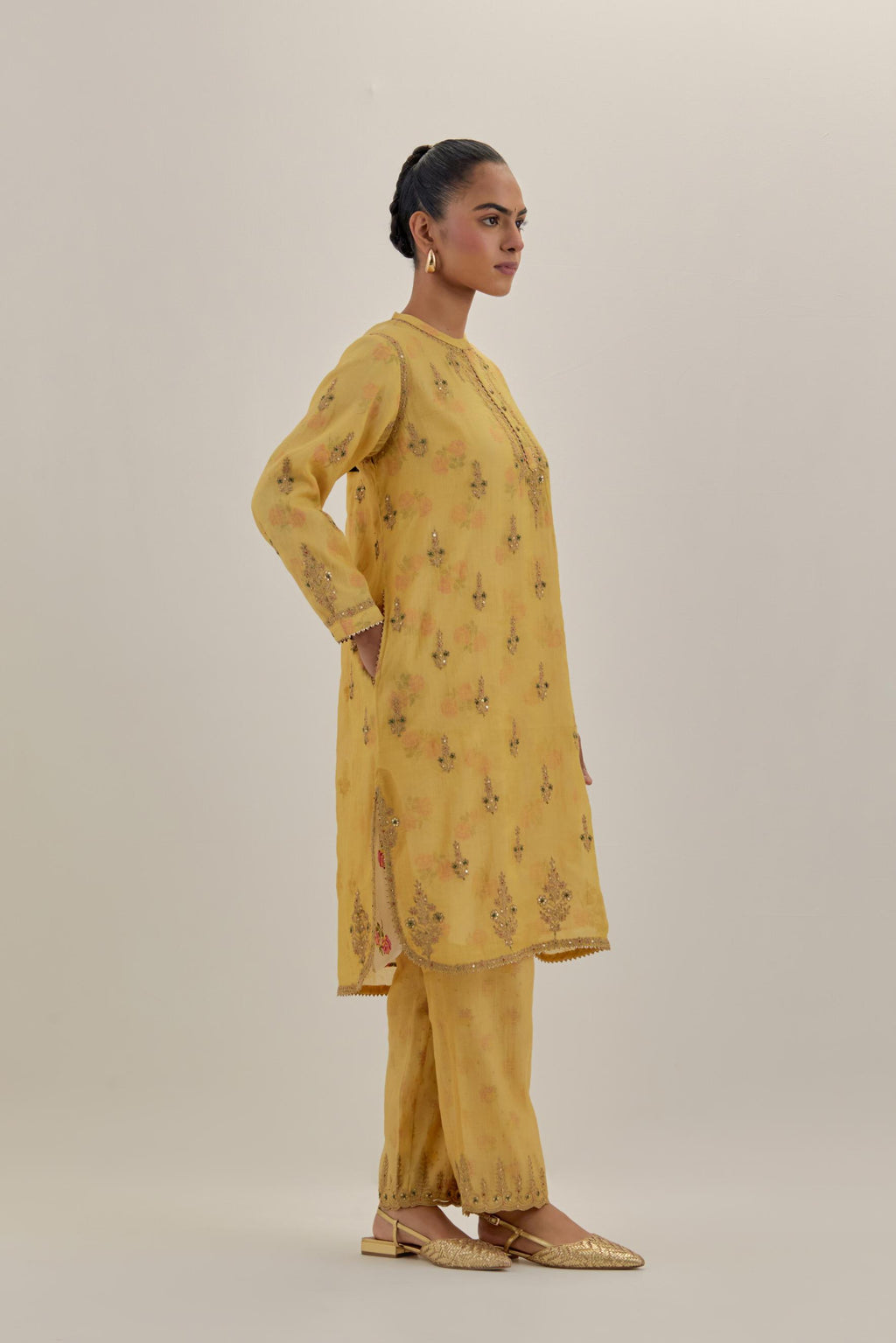 Yellow tissue chanderi straight short kurta set with all-over light gold dori embroidery.