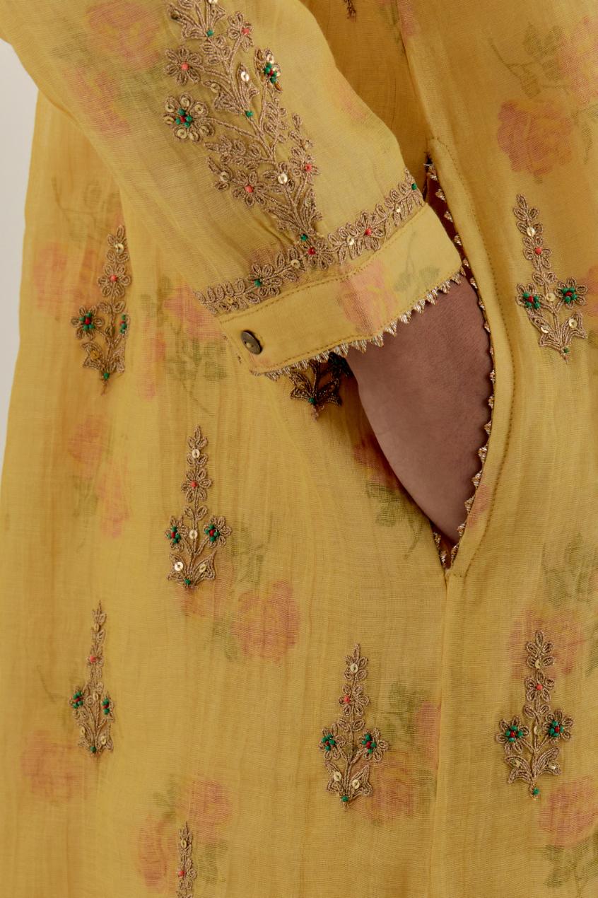 Yellow tissue chanderi straight short kurta set with all-over light gold dori embroidery.