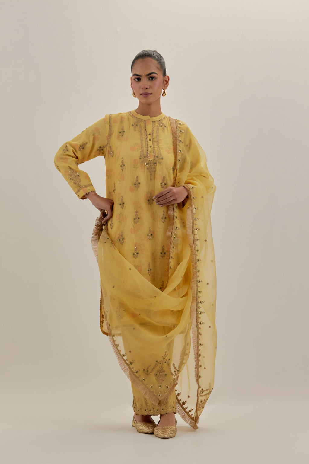 Yellow tissue chanderi straight short kurta set with all-over light gold dori embroidery.