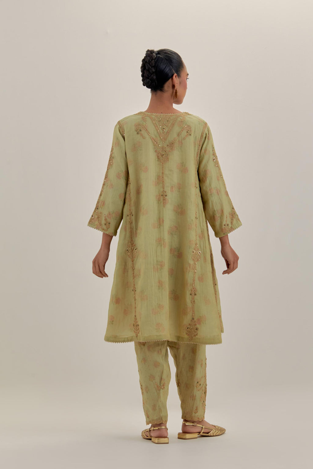 Green tissue chanderi easy fit short kalidar kurta set with light gold dori embroidery and hand block printed lining inside.