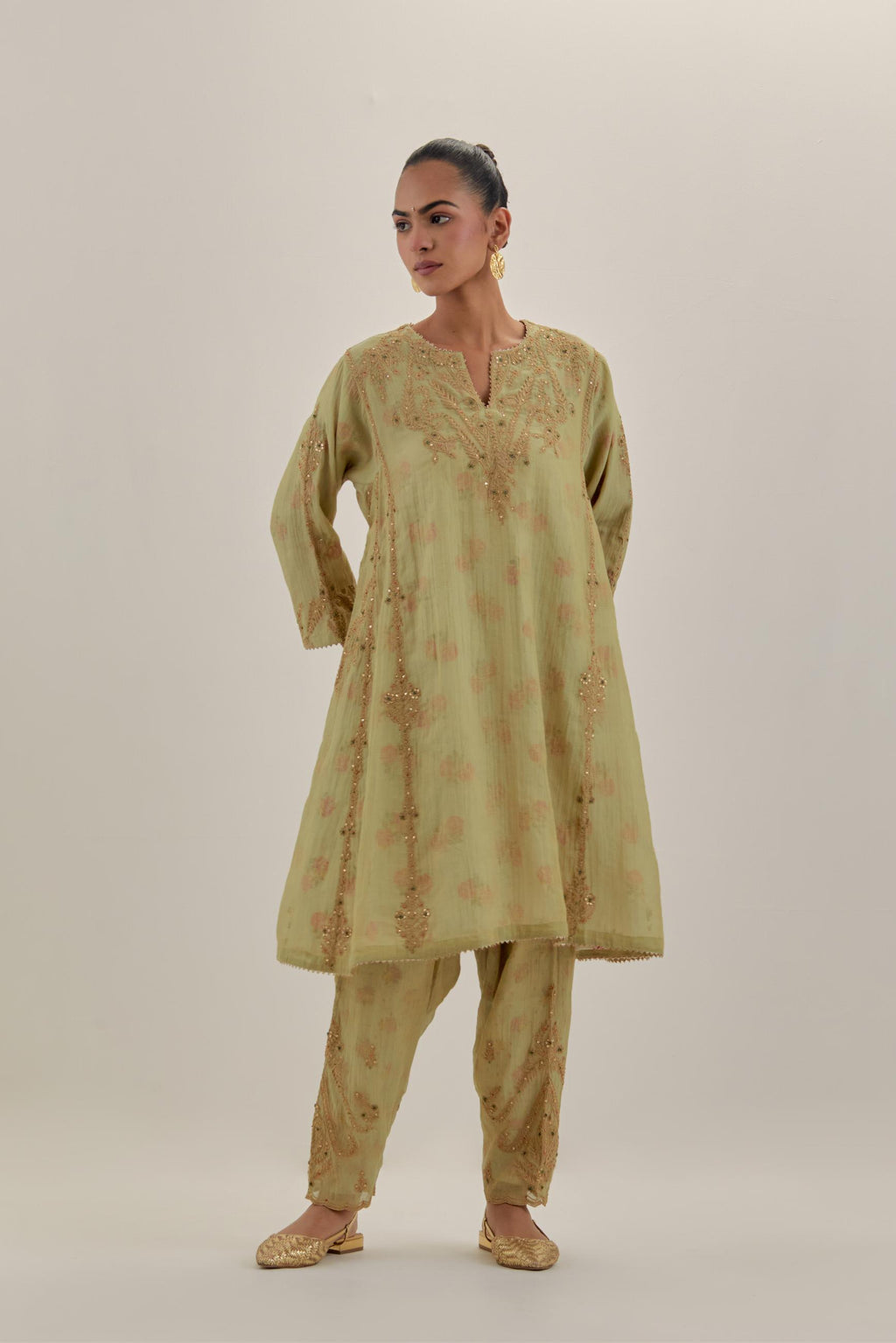 Green tissue chanderi easy fit short kalidar kurta set with light gold dori embroidery and hand block printed lining inside.