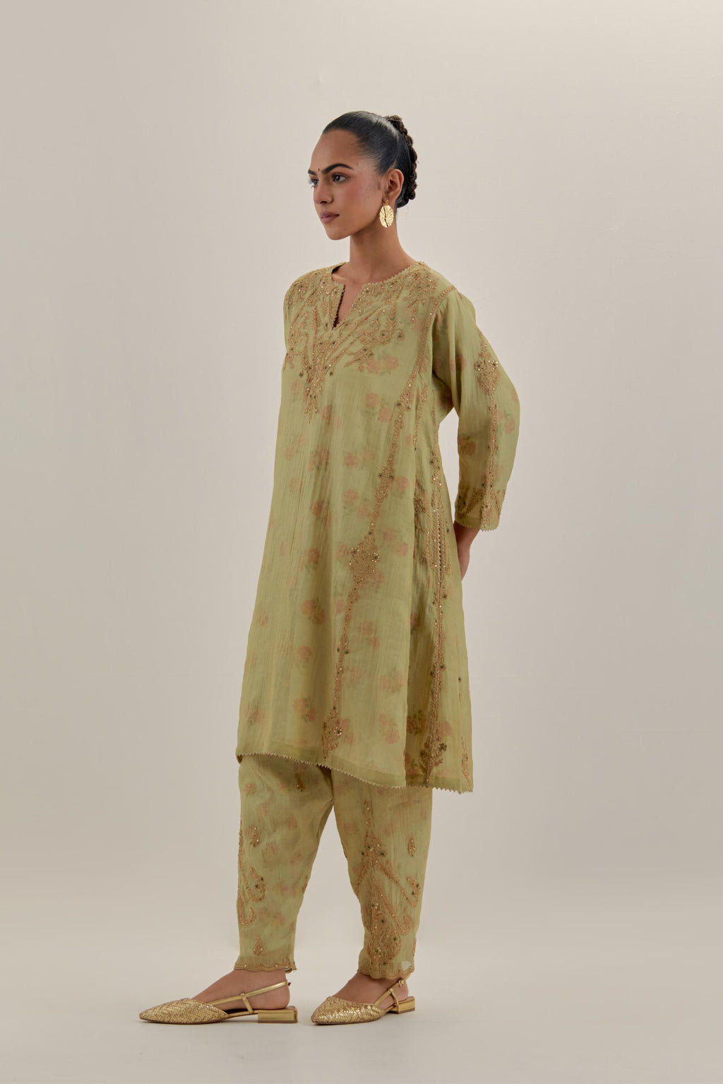 Green tissue chanderi easy fit short kalidar kurta set with light gold dori embroidery and hand block printed lining inside.