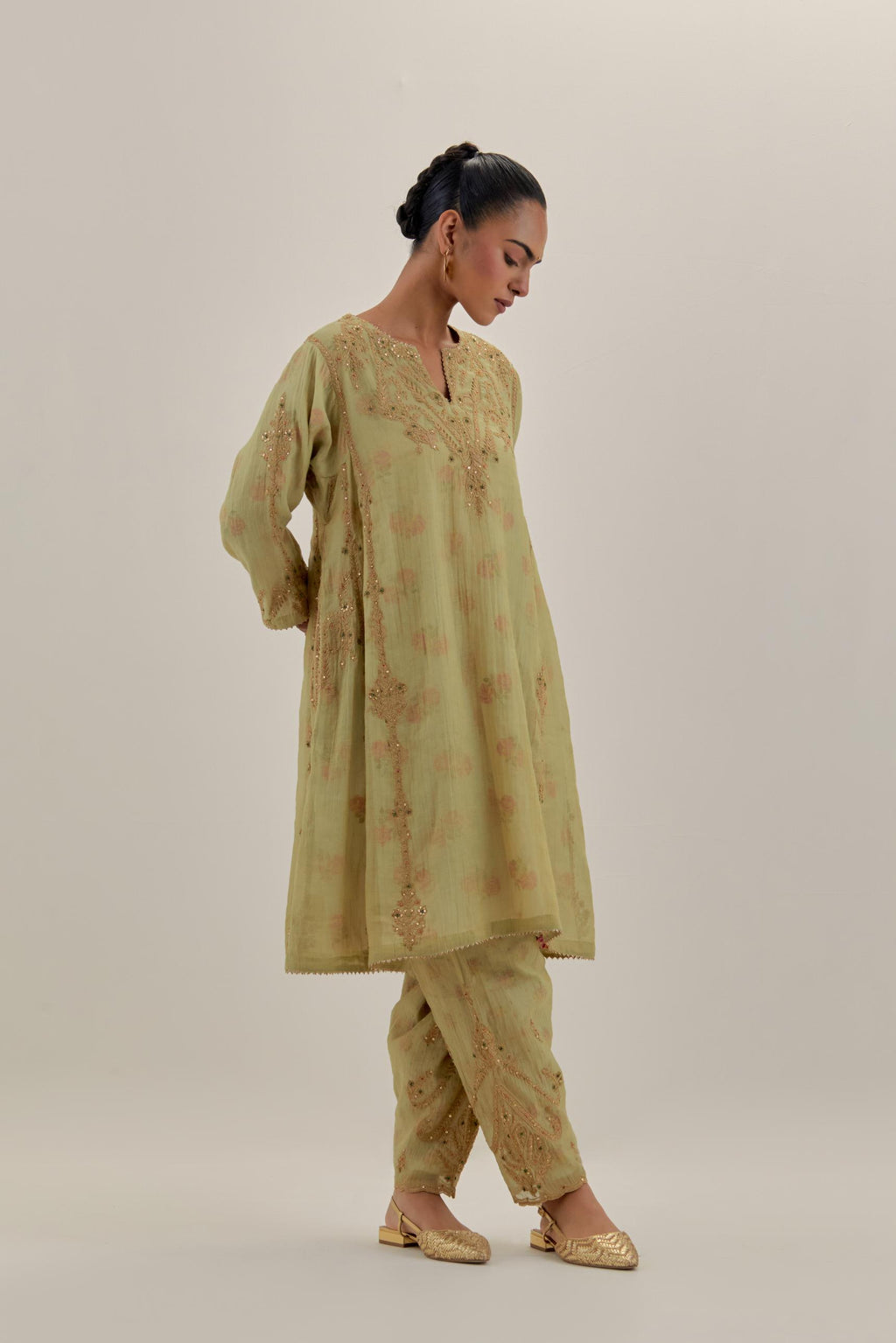 Green tissue chanderi easy fit short kalidar kurta set with light gold dori embroidery and hand block printed lining inside.