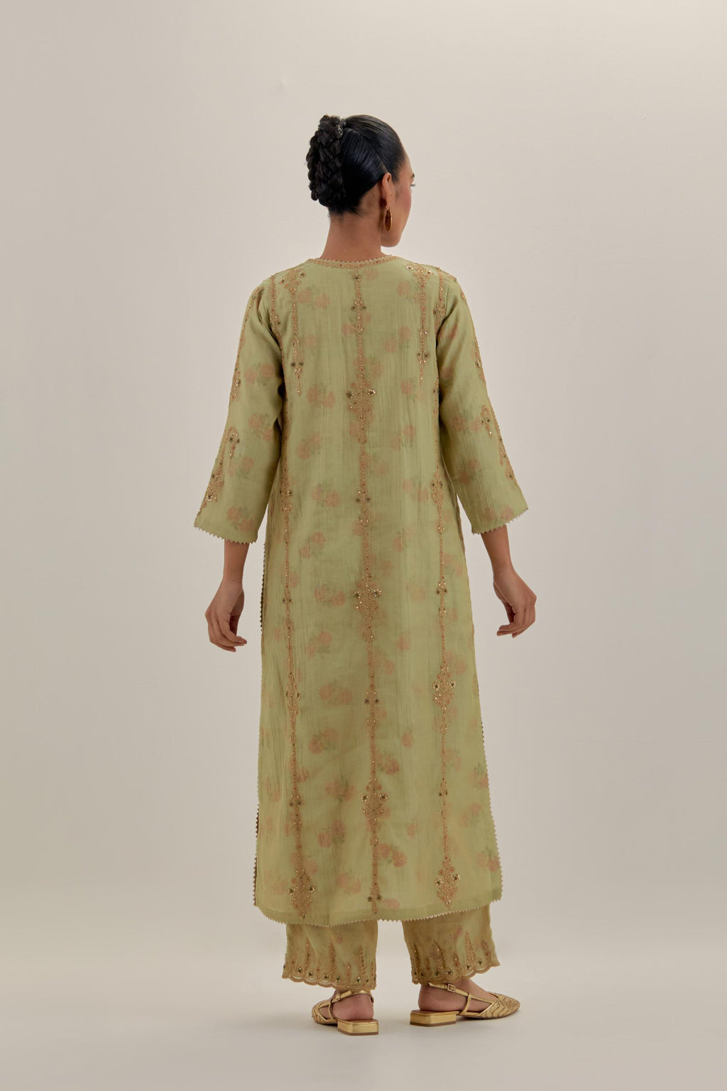 Green tissue chanderi straight kurta set with light gold dori embroidery, highlighted with multi color bead sequins work.