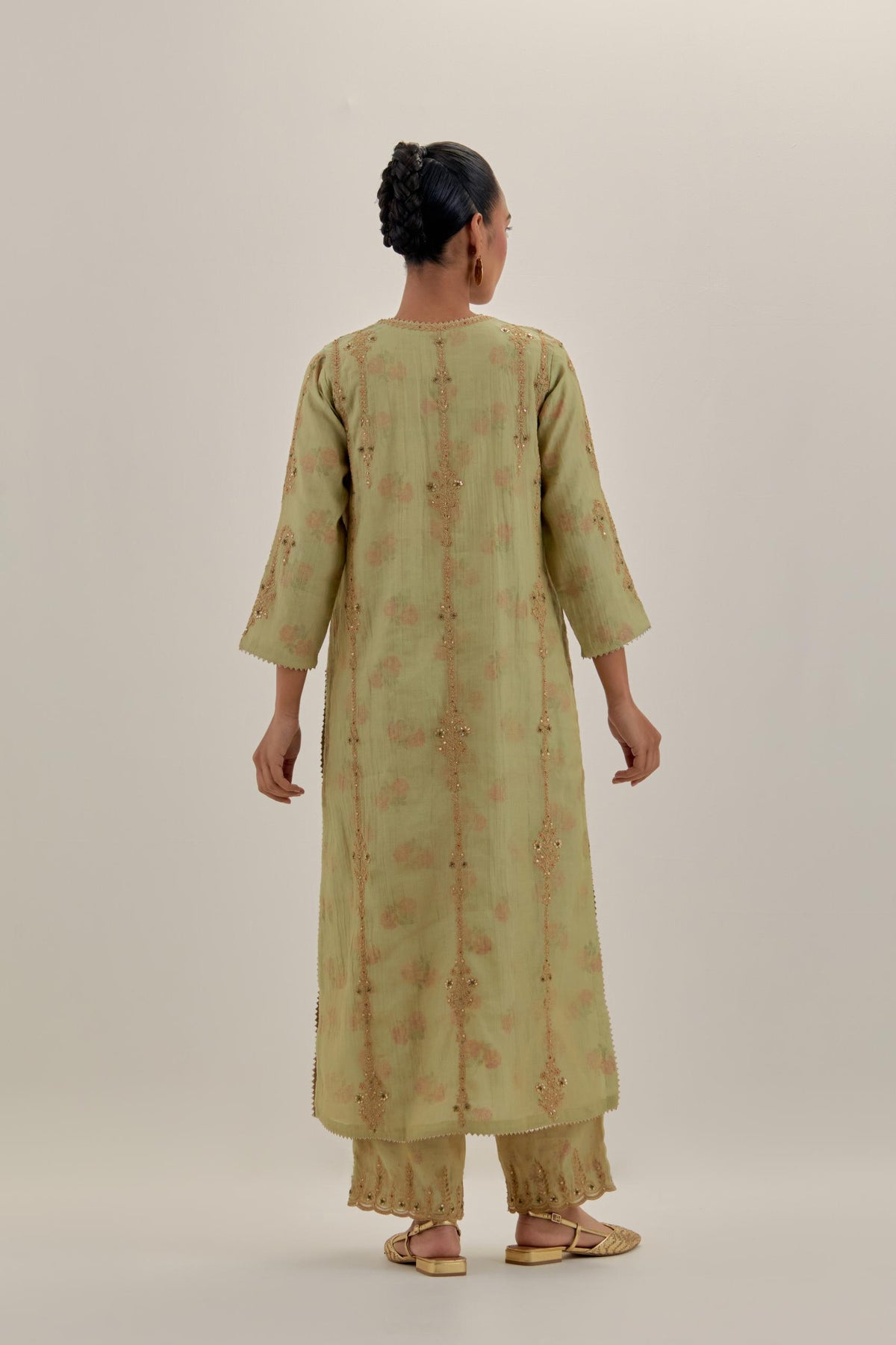 Green tissue chanderi straight kurta set with light gold dori embroidery, highlighted with multi color bead sequins work.