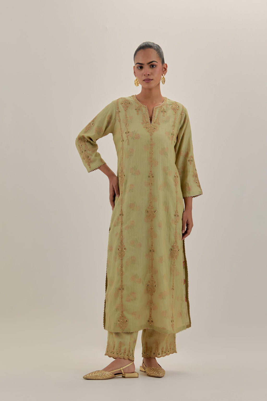 Green tissue chanderi straight kurta set with light gold dori embroidery, highlighted with multi color bead sequins work.
