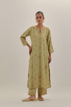 Green tissue chanderi straight kurta set with light gold dori embroidery, highlighted with multi color bead sequins work.