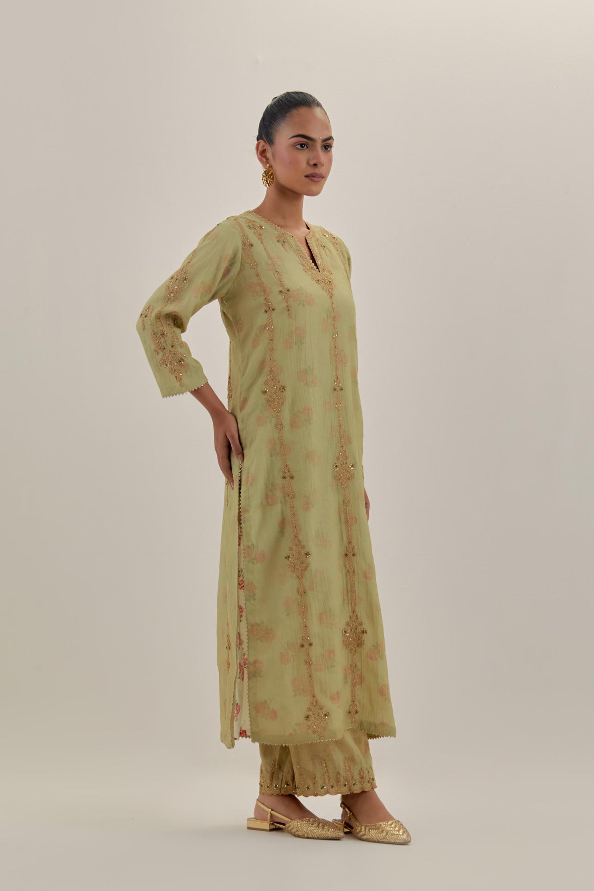 Green tissue chanderi straight kurta set with light gold dori embroidery, highlighted with multi color bead sequins work.