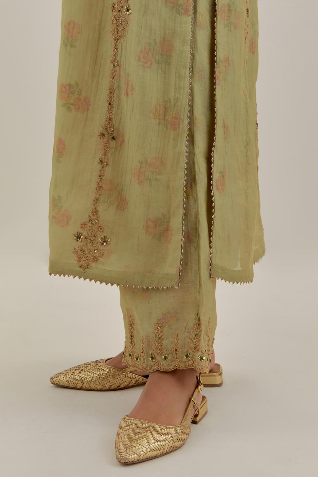Green tissue chanderi straight kurta set with light gold dori embroidery, highlighted with multi color bead sequins work.