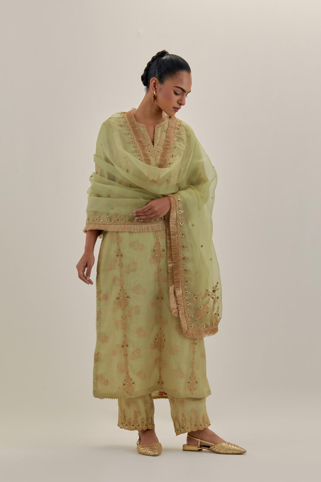 Green tissue chanderi straight kurta set with light gold dori embroidery, highlighted with multi color bead sequins work.