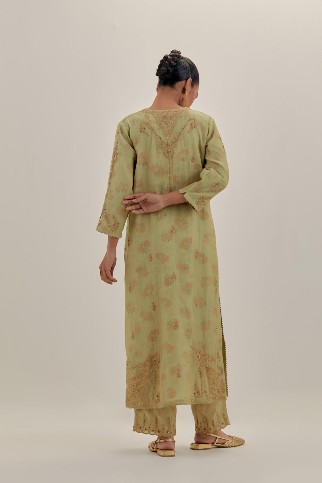 Green tissue chanderi straight kurta set, highlighted with light gold dori embroidery and hand block printed lining inside.