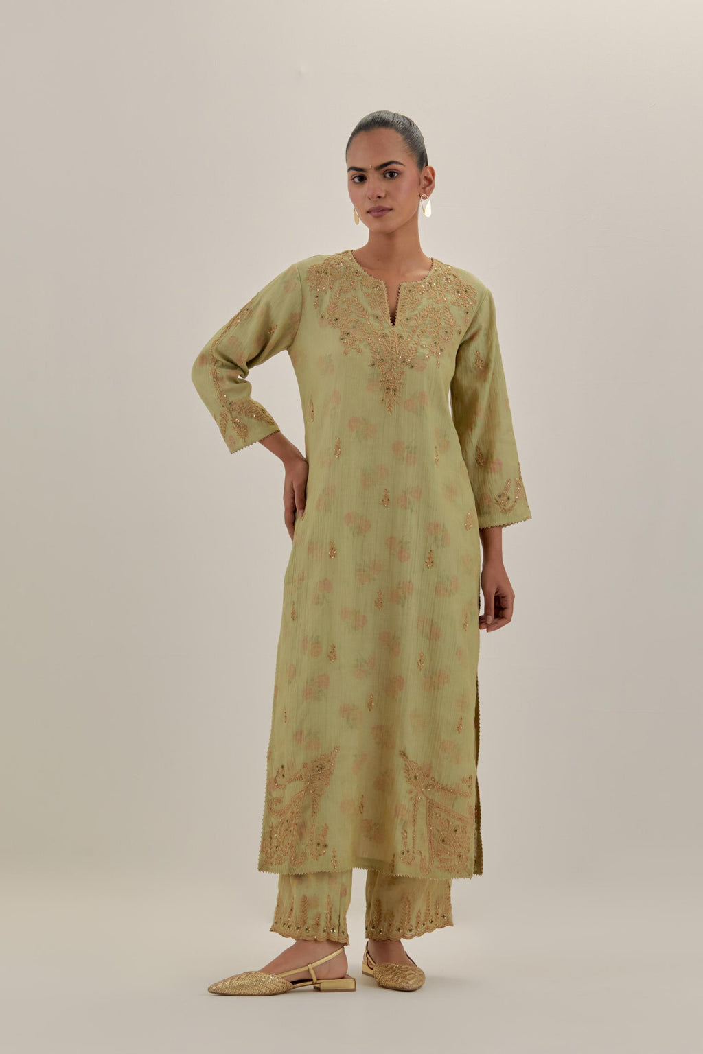 Green tissue chanderi straight kurta set, highlighted with light gold dori embroidery and hand block printed lining inside.