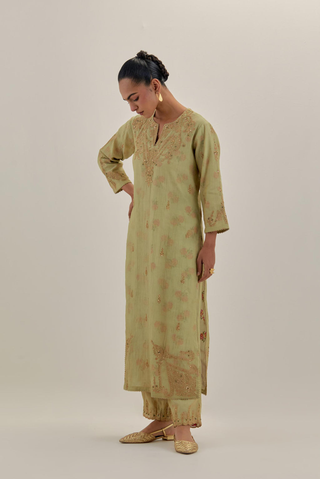 Green tissue chanderi straight kurta set, highlighted with light gold dori embroidery and hand block printed lining inside.