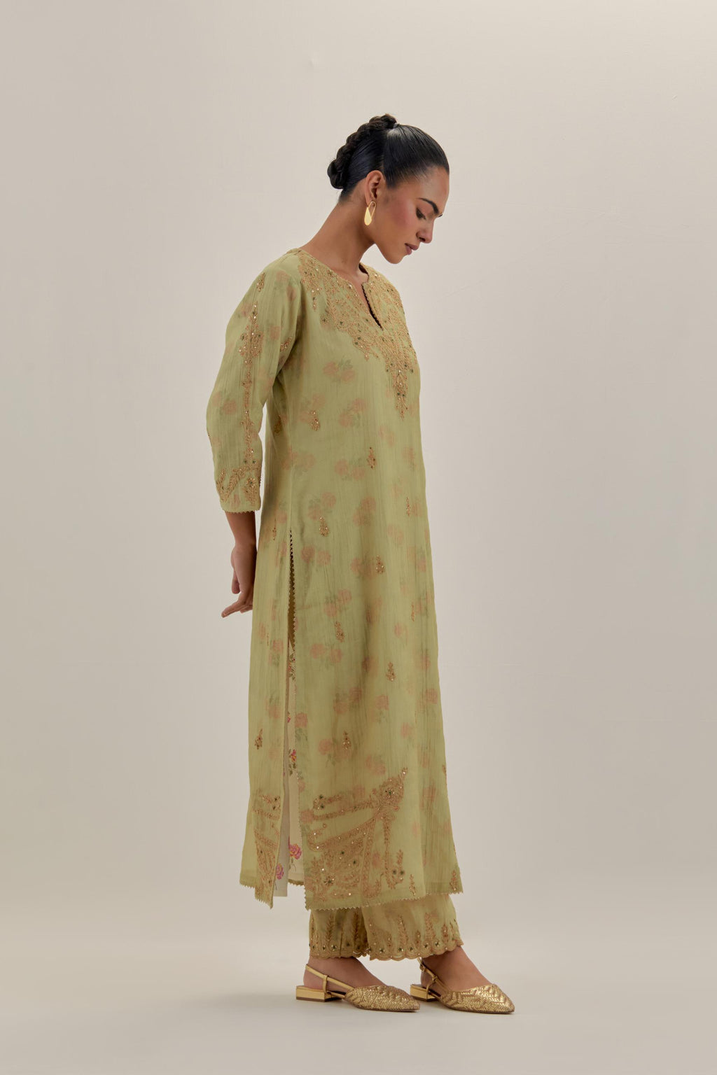 Green tissue chanderi straight kurta set, highlighted with light gold dori embroidery and hand block printed lining inside.