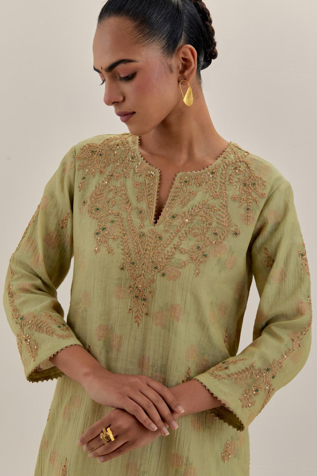Green tissue chanderi straight kurta set, highlighted with light gold dori embroidery and hand block printed lining inside.