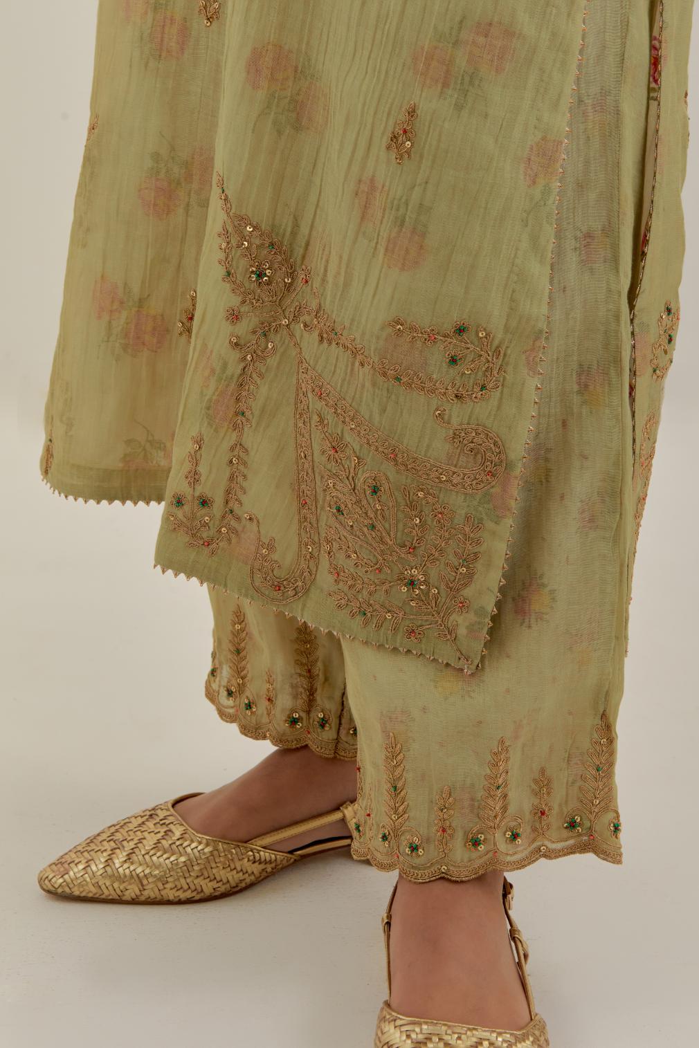 Green tissue chanderi straight kurta set, highlighted with light gold dori embroidery and hand block printed lining inside.