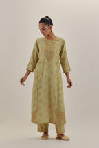 Green tissue chanderi straight kurta set with button placket neckline, highlighted with all-over light gold dori embroidery.