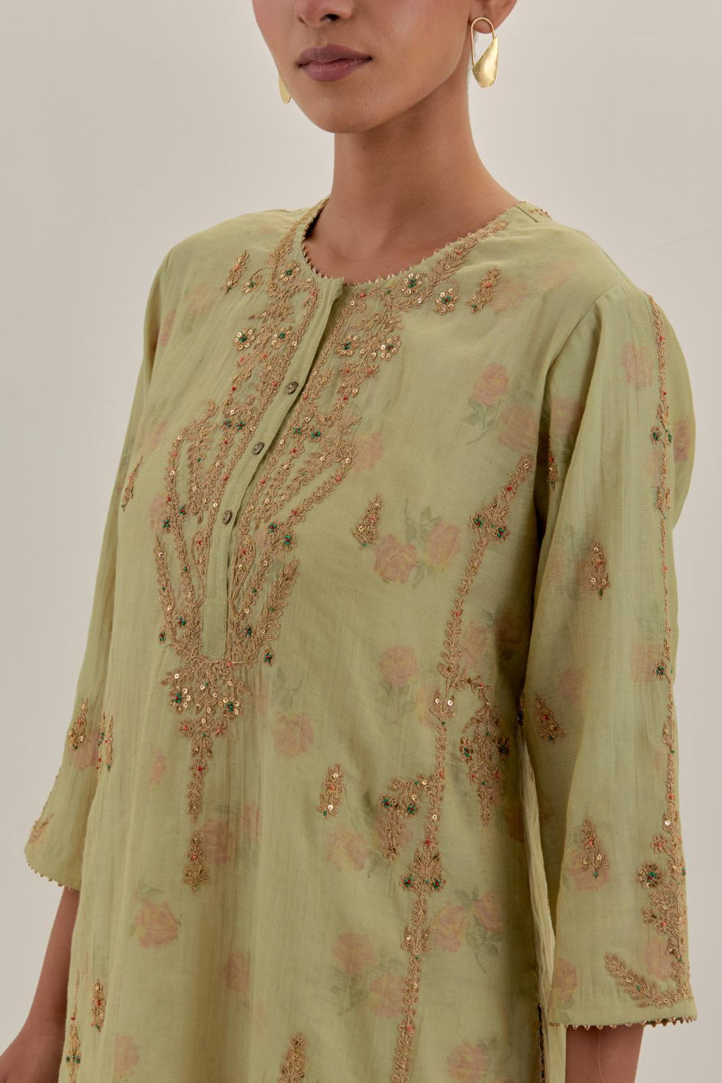 Green tissue chanderi straight kurta set with button placket neckline, highlighted with all-over light gold dori embroidery.