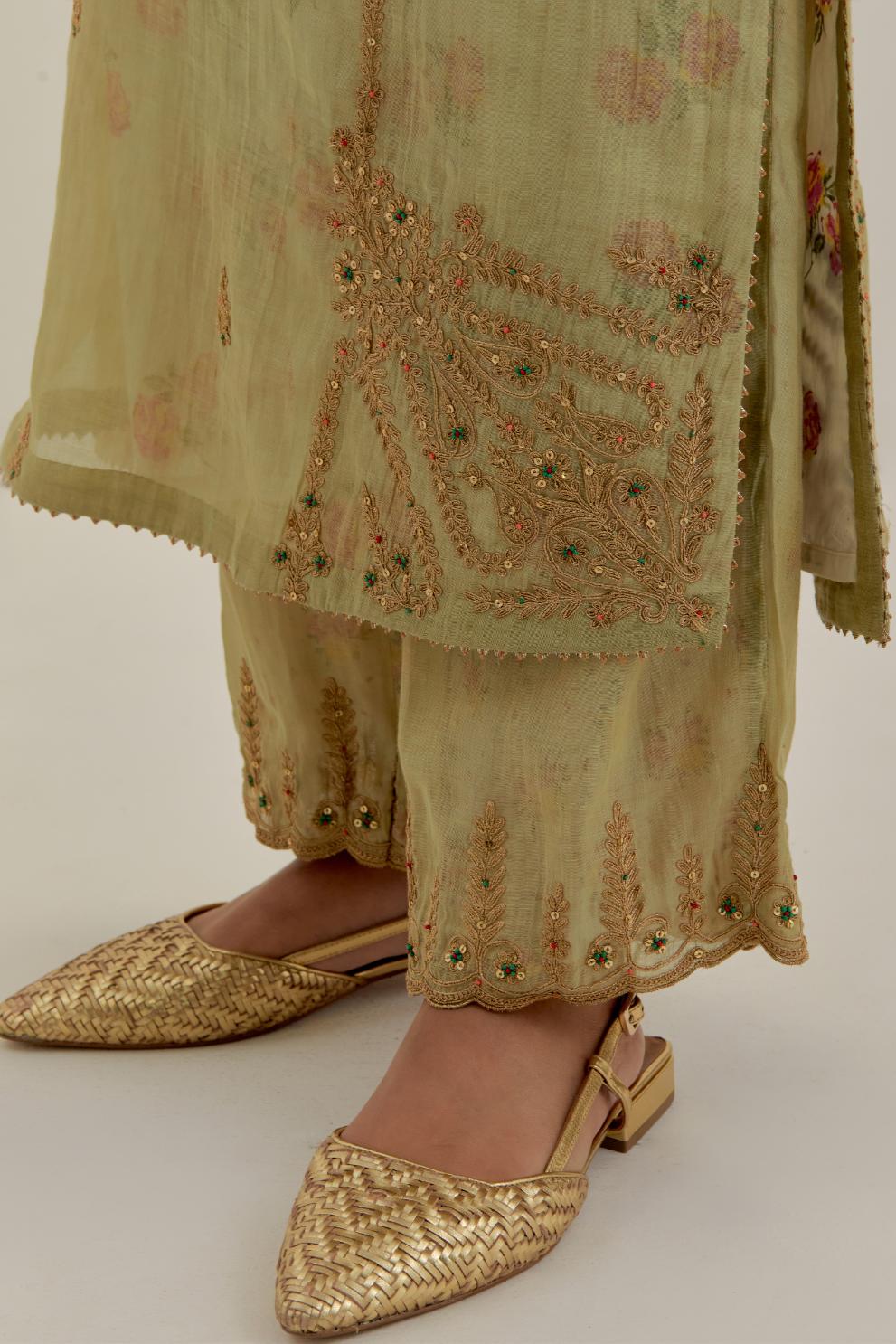 Green tissue chanderi straight kurta set, highlighted with light gold dori embroidery and hand block printed lining inside.