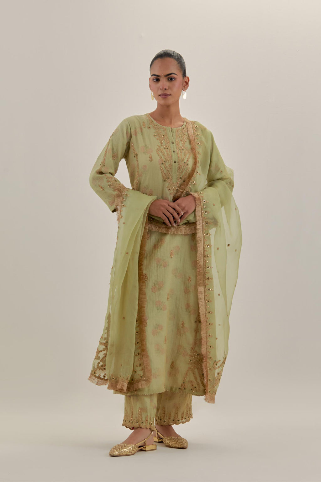 Green tissue chanderi straight kurta set with button placket neckline, highlighted with all-over light gold dori embroidery.