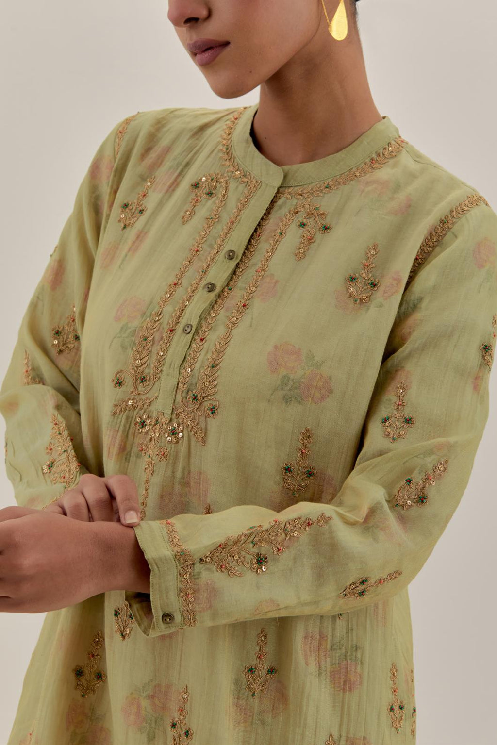 Green tissue chanderi straight short kurta set with all-over light gold dori embroidery.