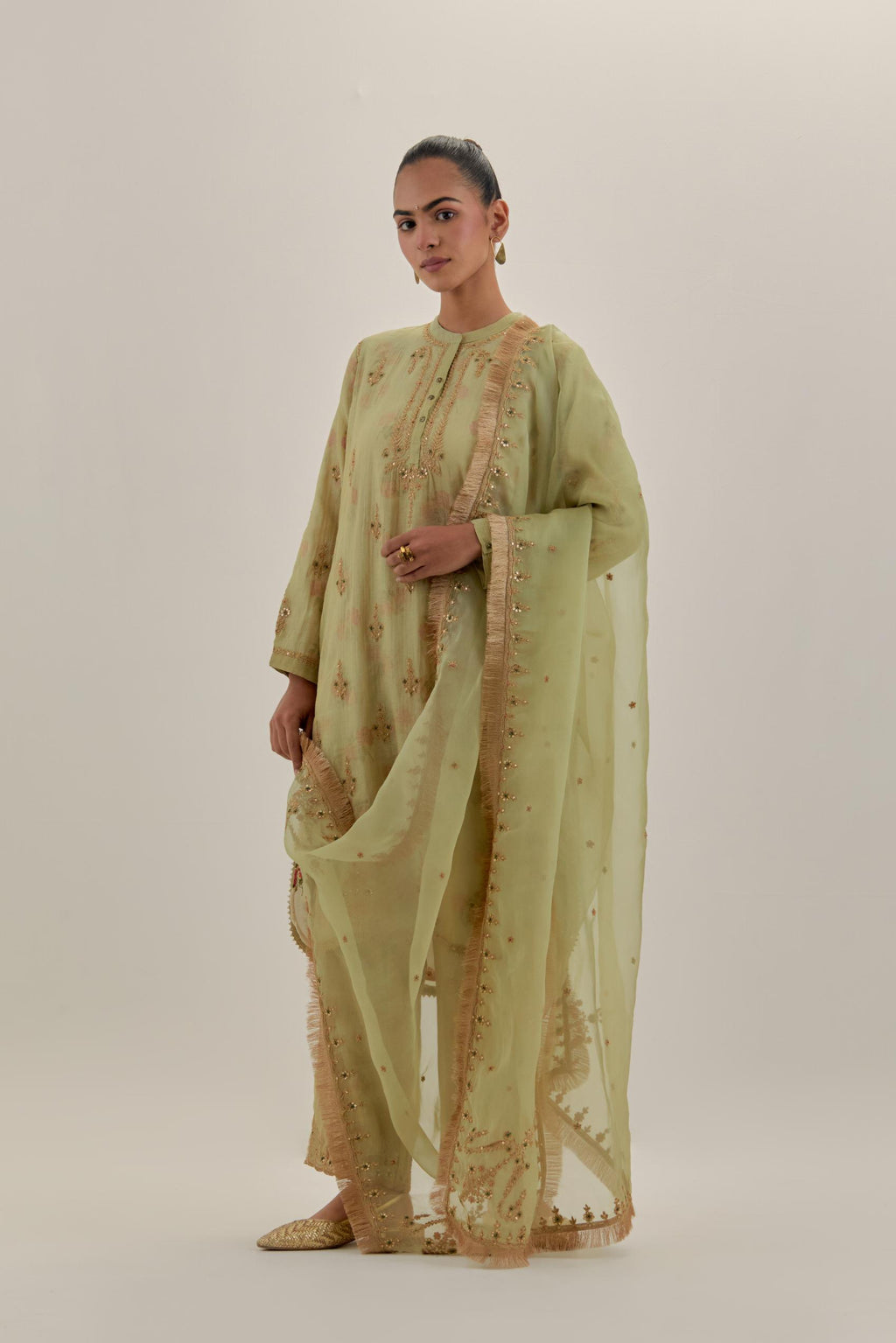 Green tissue chanderi straight short kurta set with all-over light gold dori embroidery.