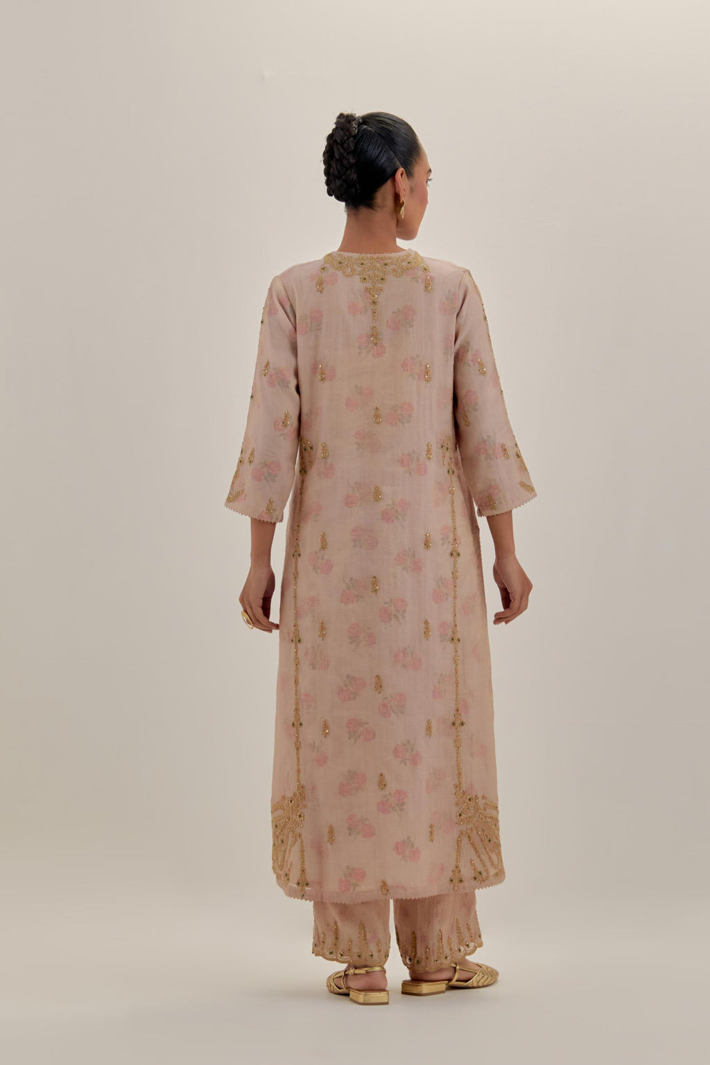 Pink tissue chanderi straight kurta set with button placket neckline, highlighted with all-over light gold dori embroidery.