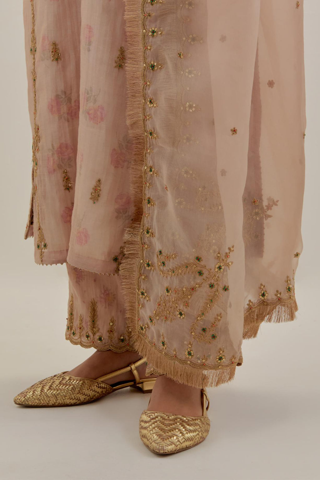 Pink silk organza dupatta detailed with all-over light gold dori embroidery, highlighted with multi colored beads & gold sequins.