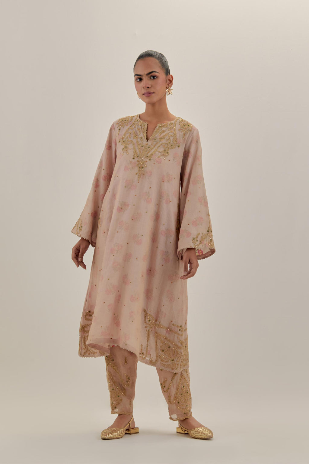 Pink tissue chanderi A-line kurta set highlighted with light gold dori embroidery and hand block printed lining inside.