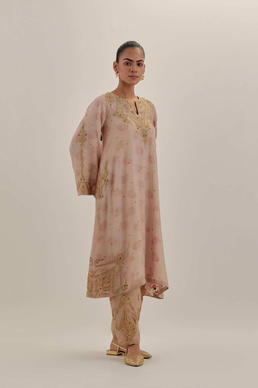 Pink tissue chanderi A-line kurta set highlighted with light gold dori embroidery and hand block printed lining inside.