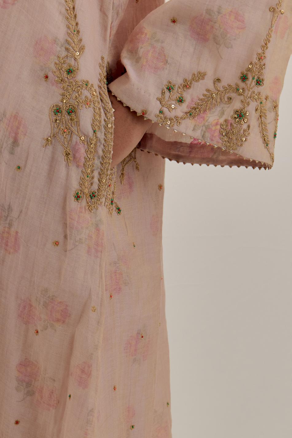 Pink tissue chanderi A-line kurta set highlighted with light gold dori embroidery and hand block printed lining inside.