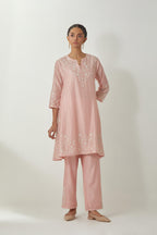 Pink silk Chanderi short kalidar kurta set with all-over off white silk thread embroidery, highlighted with beads and sequins work.