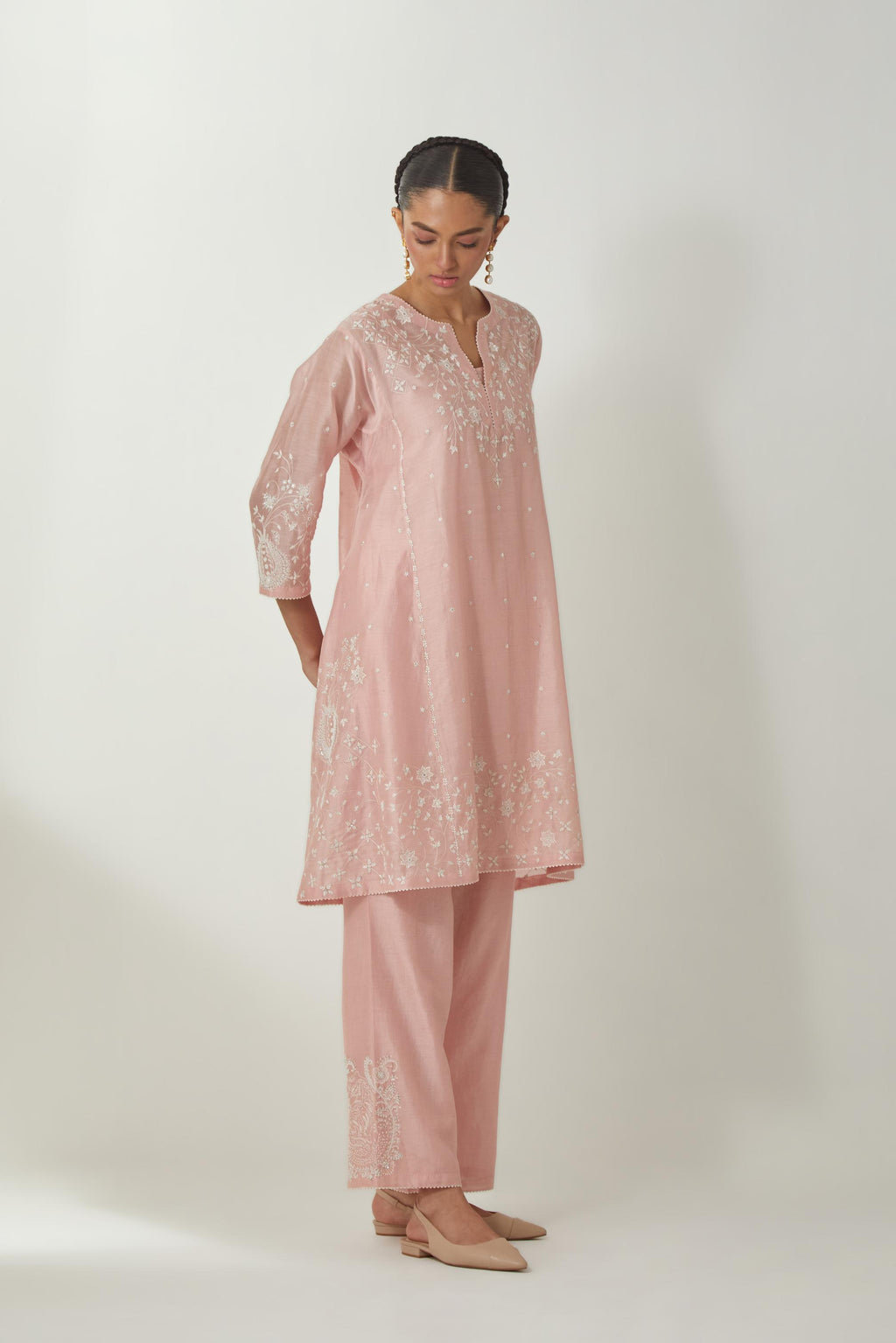 Pink silk Chanderi short kalidar kurta set with all-over off white silk thread embroidery, highlighted with beads and sequins work.