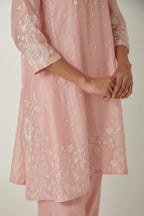 Pink silk Chanderi short kalidar kurta set with all-over off white silk thread embroidery, highlighted with beads and sequins work.