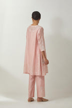 Pink silk Chanderi short kalidar kurta set with all-over off white silk thread embroidery, highlighted with beads and sequins work.