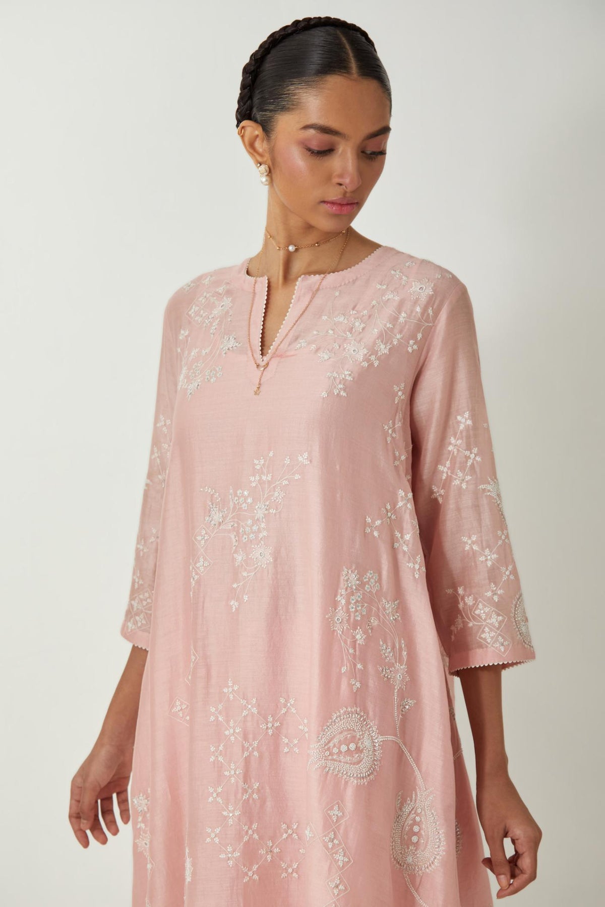 Pink silk Chanderi short easy fit kurta set with straight hem and all-over off white silk thread embroidery, highlighted with beads and sequins work.