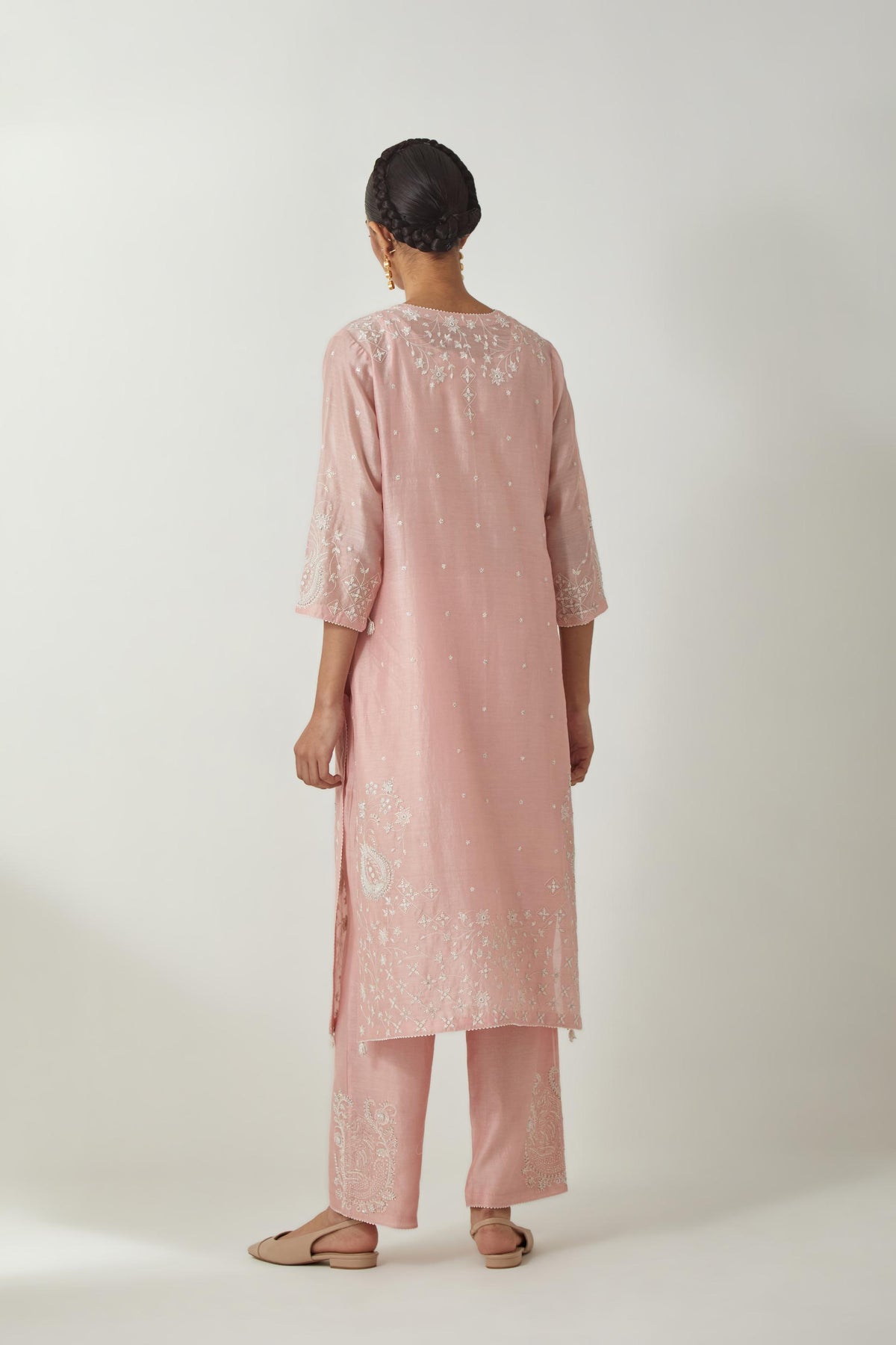 Pink silk Chanderi straight mid length kurta set with all-over off white silk thread embroidery, highlighted with beads, and sequins work at neck & hem.