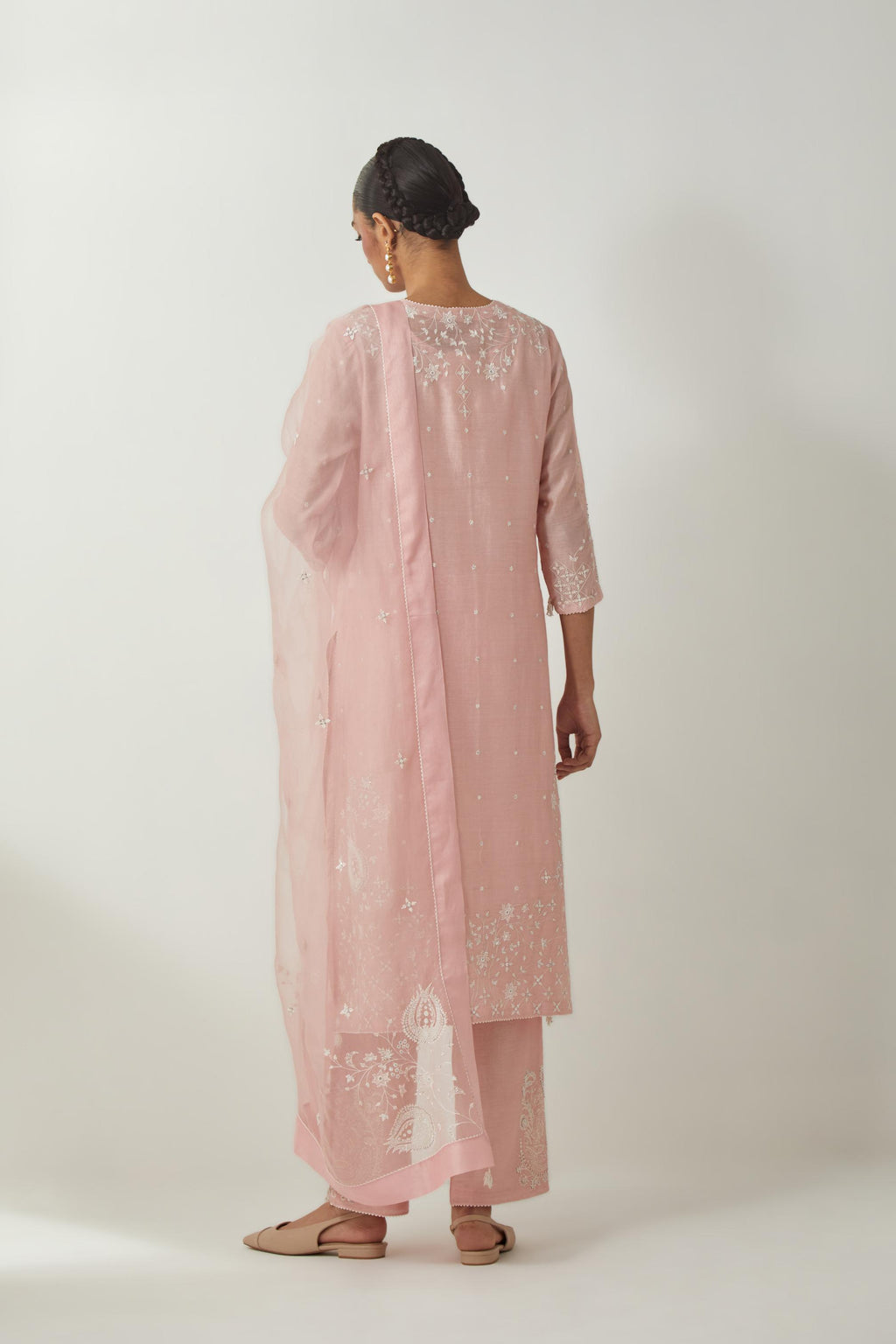 Pink silk Chanderi straight mid length kurta set with all-over off white silk thread embroidery, highlighted with beads, and sequins work at neck & hem.