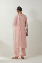 Pink silk Chanderi straight mid length kurta set with all-over off white silk thread embroidery, highlighted with beads, and sequins work at neck & hem.