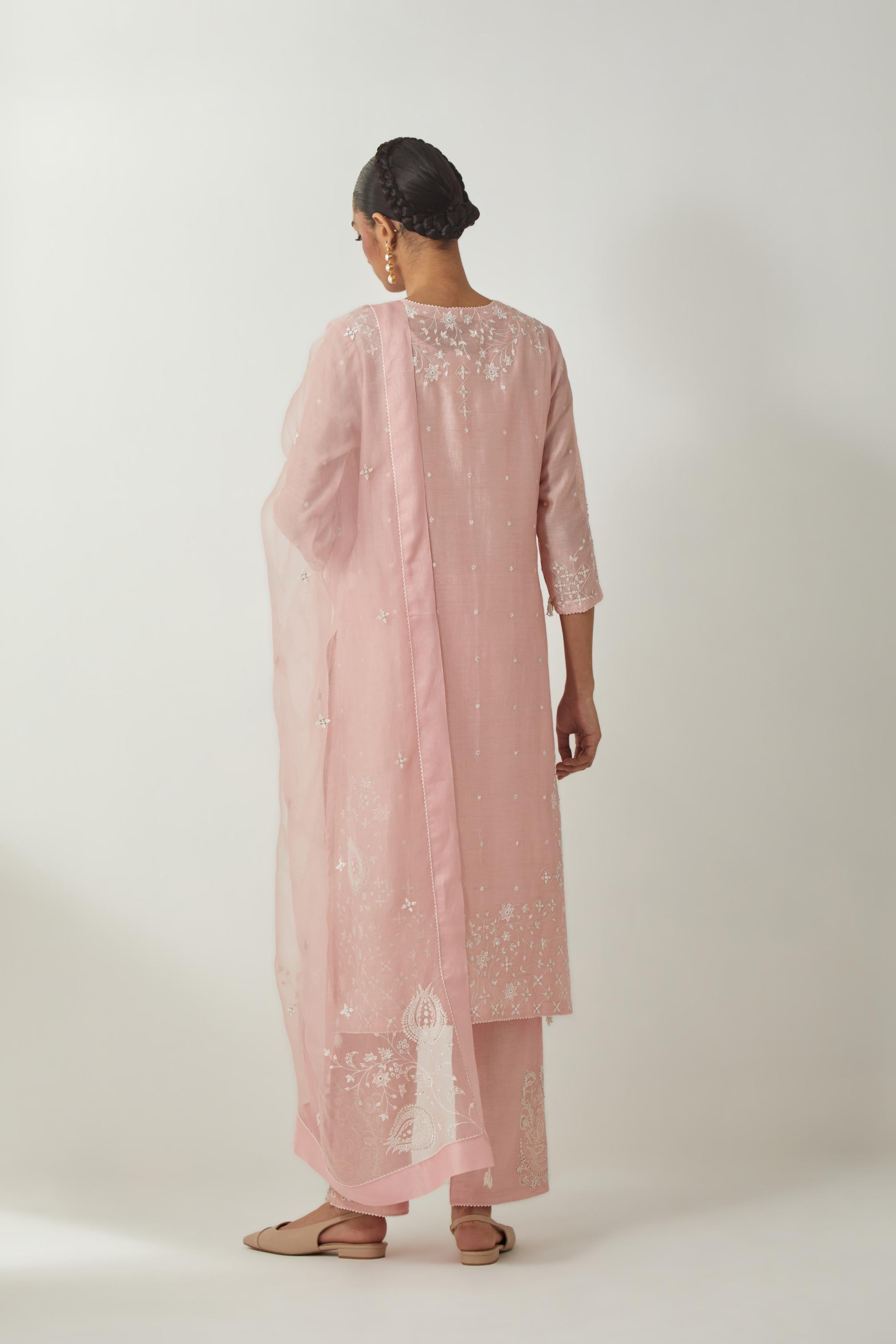 Pink silk Chanderi straight mid length kurta set with all-over off white silk thread embroidery, highlighted with beads, and sequins work at neck & hem.