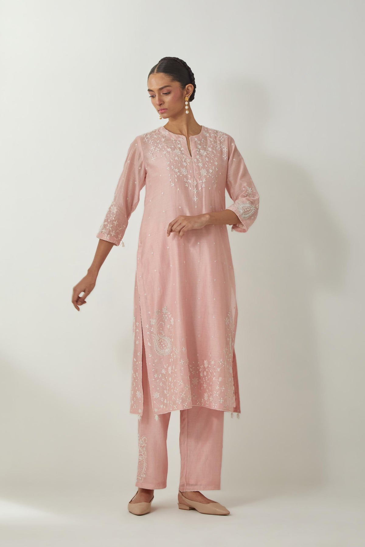 Pink silk Chanderi straight mid length kurta set with all-over off white silk thread embroidery, highlighted with beads, and sequins work at neck & hem.